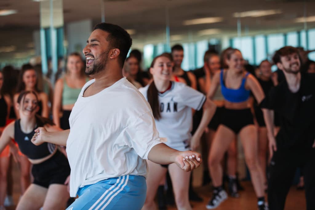 Performers College students dancing inside
