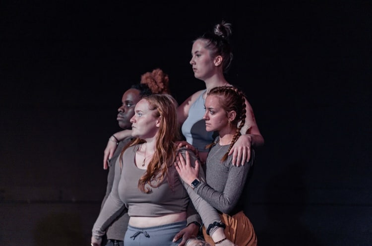 Tia on stage with fellow students