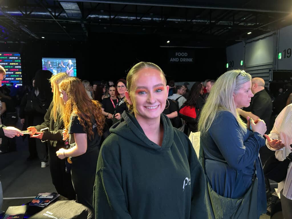 Layla poses on the performas college stand at Move it 2024