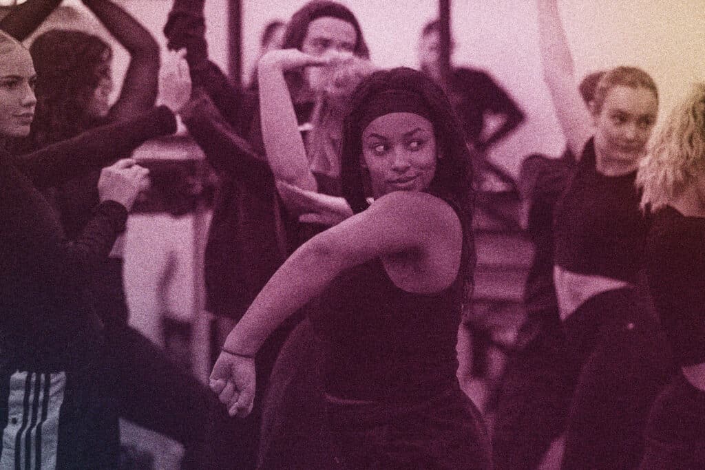 a student rehearses at our essex campus with a determined look on her face
