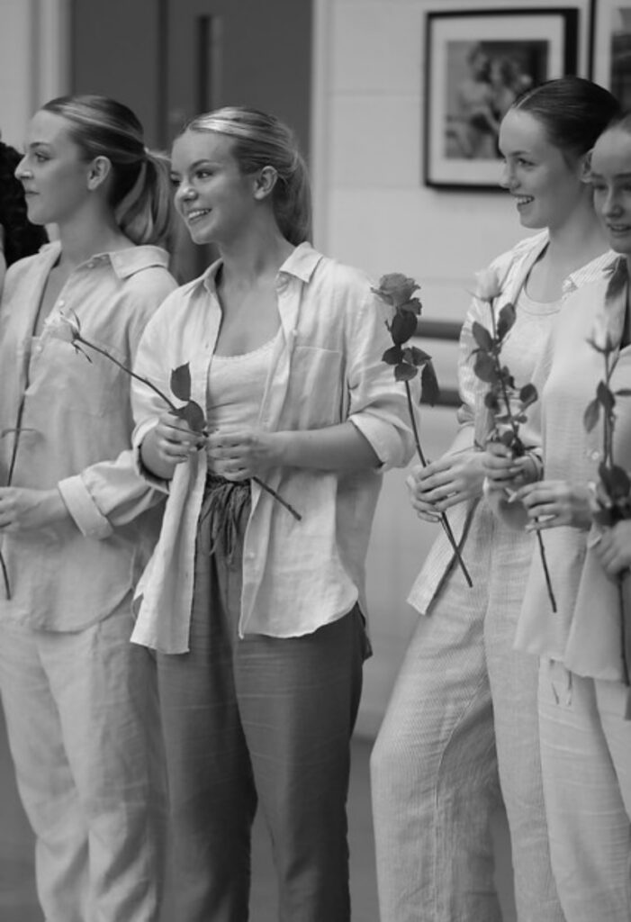 Amelia stands with fellow students at an event