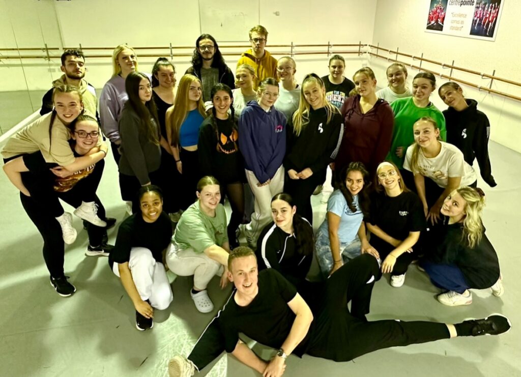 shea poses for a group photo with his fellow students