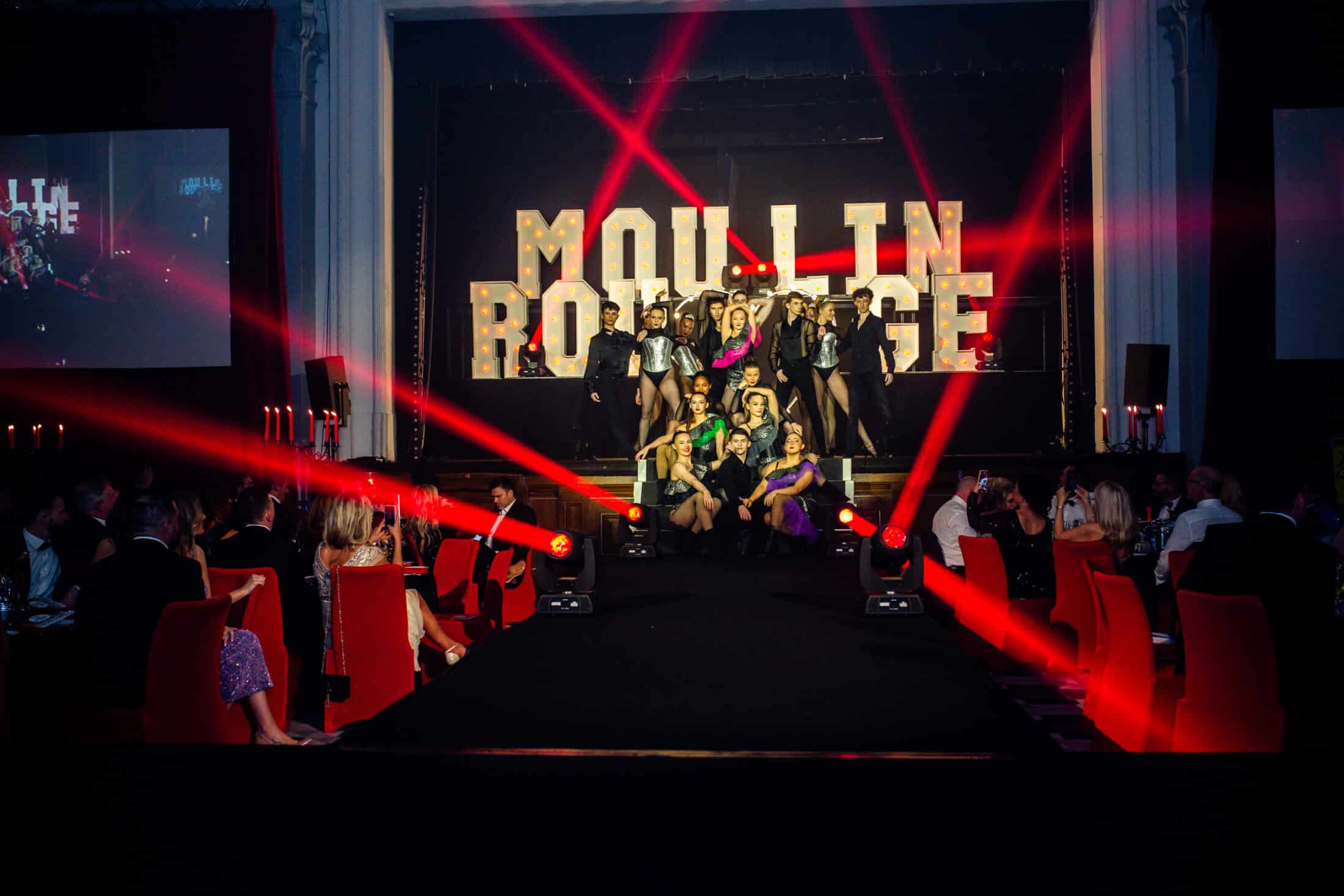 Performers College stuents pose on stage at the event