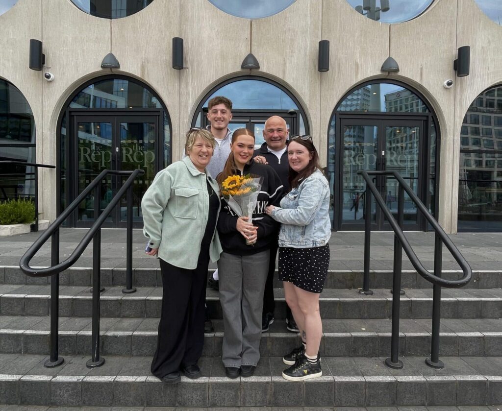 billie poses with friends outside Birmingham Rep Theatre