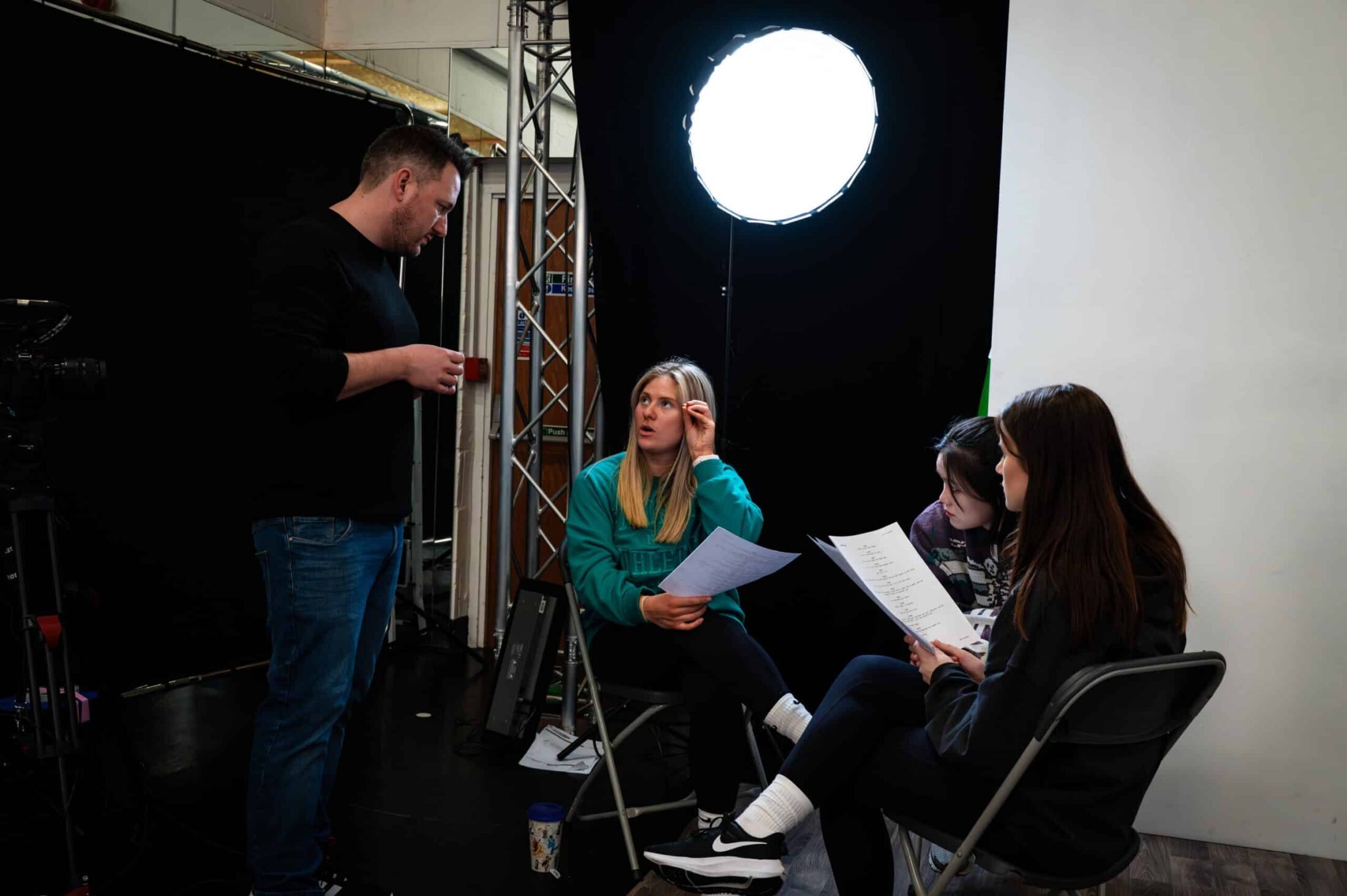 Masters students listen to a lecturer