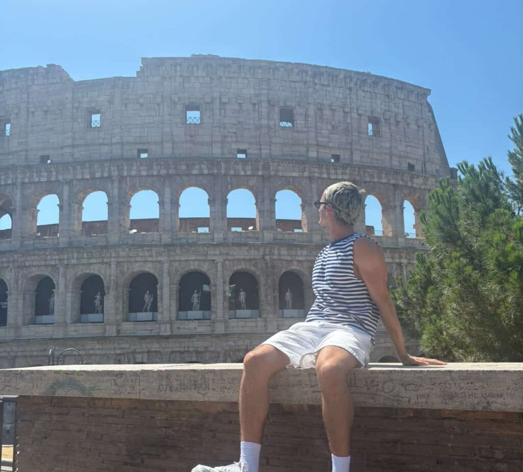 Tate Harrison outside the colosseum in Rome