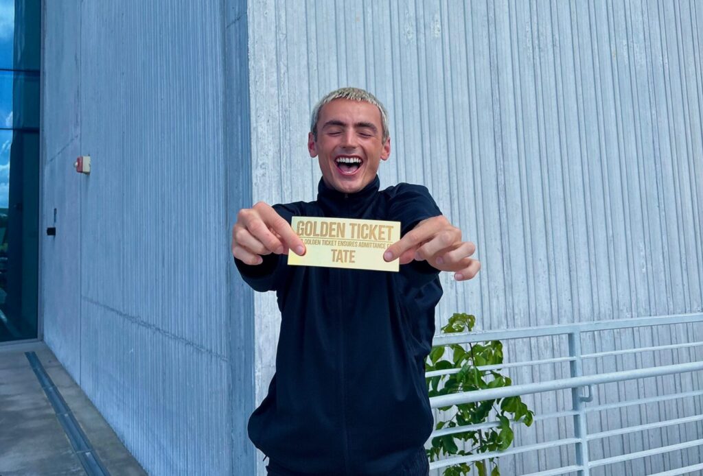 Tate Harrison holding a golden ticket
